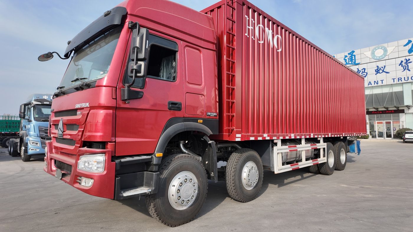 Red HOWO 371 8x4 box van truck, current vehicle photo